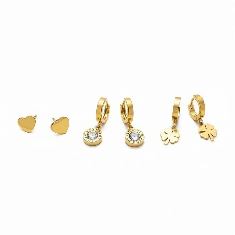 A set of three pairs of gold earrings; combining a delicate heart-shaped design, dangling circles with sparkling zircon stones, and a charming dangling rose. Made of durable stainless steel for a unique look. - Image 1